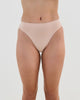 Model wears Seamless Soft High Cut Brief in LATTE. On body front view