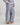 Model wears Cosy Flannel Long Pj Pant in NAVY BLAZER. On body side view