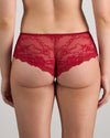 Model wears My Fit Lace Brazilian in JESTER RED. On body back view