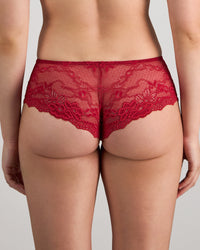 Model wears My Fit Lace Brazilian in JESTER RED. On body back view