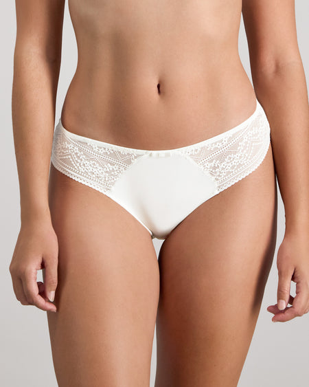 Model wears Renee Bikini in WHITE. On body front view