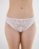 Model wears Embrace Bikini in WHITE. On body front view