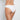 Model wears Seamless Bikini in WHITE. On body back view