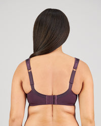 Model wears Charlotte Underwire Bra in PLUM PERFECT. On body back view