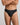 Model wears Cotton Stretch Mens Thong in BLACK. On body front view
