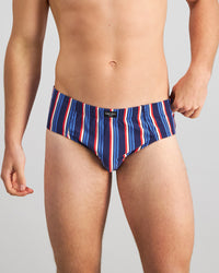 Model wears Cotton Stretch Mens Brief in BITTERSWEET/REGATTA STRIPE. On body front view