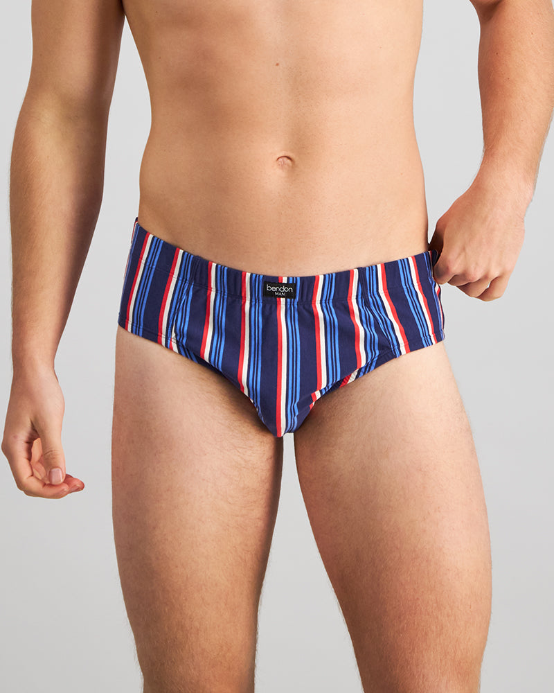 Model wears Cotton Stretch Mens Brief in BITTERSWEET/REGATTA STRIPE. On body front view