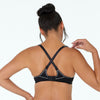 Model wears Active Contour Bra in BLACK. On body back view