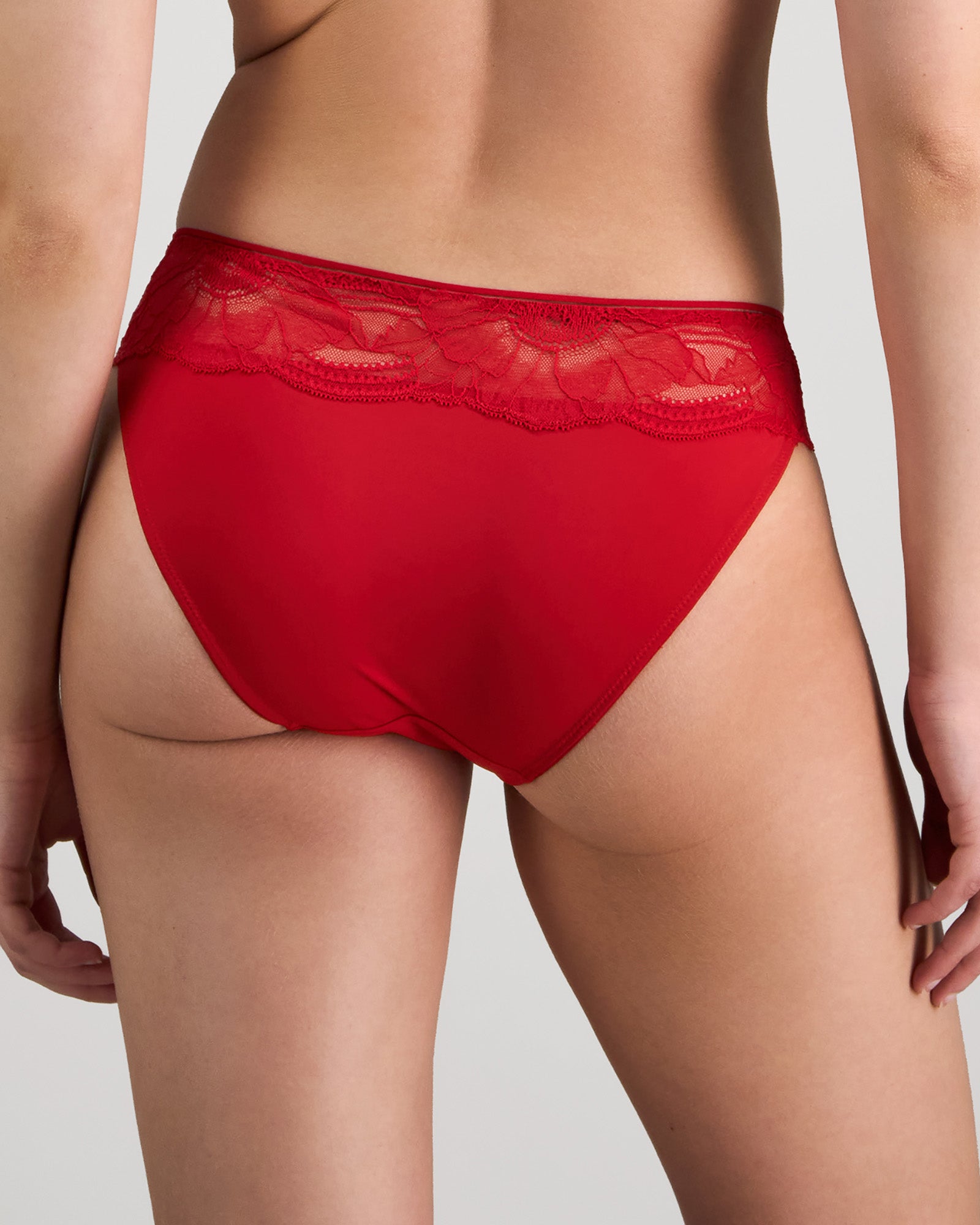 Model wears Lumiere Bikini in SALSA. On body back view