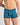 Model wears Bold Stripe Mens Trunk in DEEP TEAL/DEEP LAKE. On body front view
