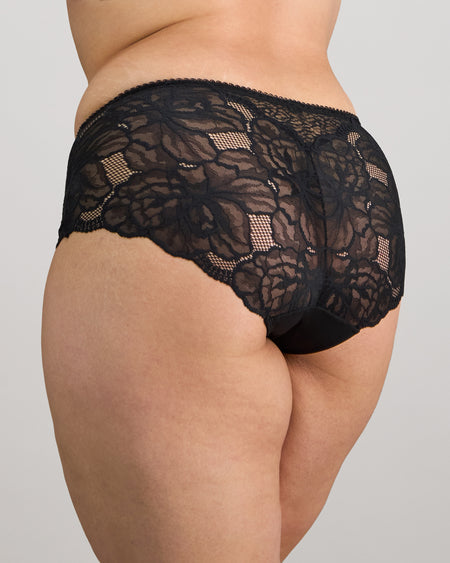 Model wears Midnight Express Full Brief in BLACK. On body front view