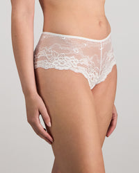 Model wears My Fit Lace Brazilian in WHITE. On body side view