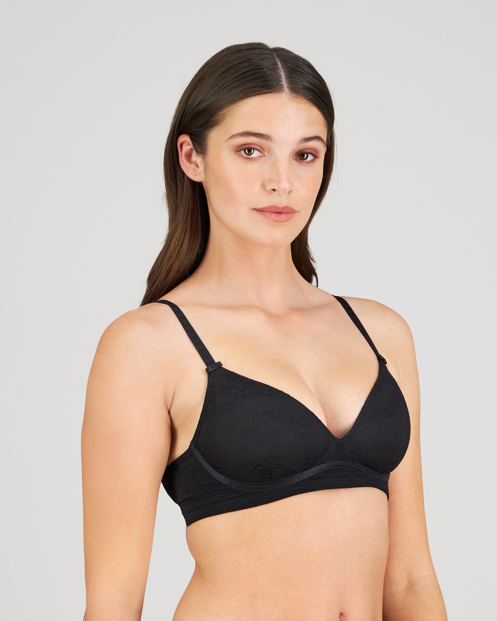 Model wears Bendon Body Lace Wire Free Bra in BLACK. On body side view