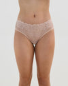 Model wears Lacey Brazilian in LATTE. On body front view