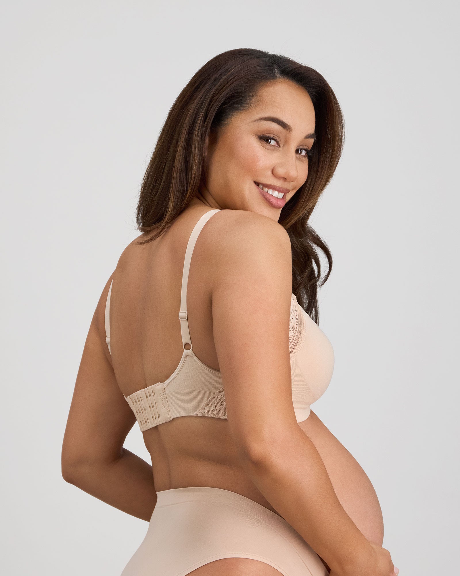 Model wears Bendon Nurture Maternity Bra in LATTE. On body back view