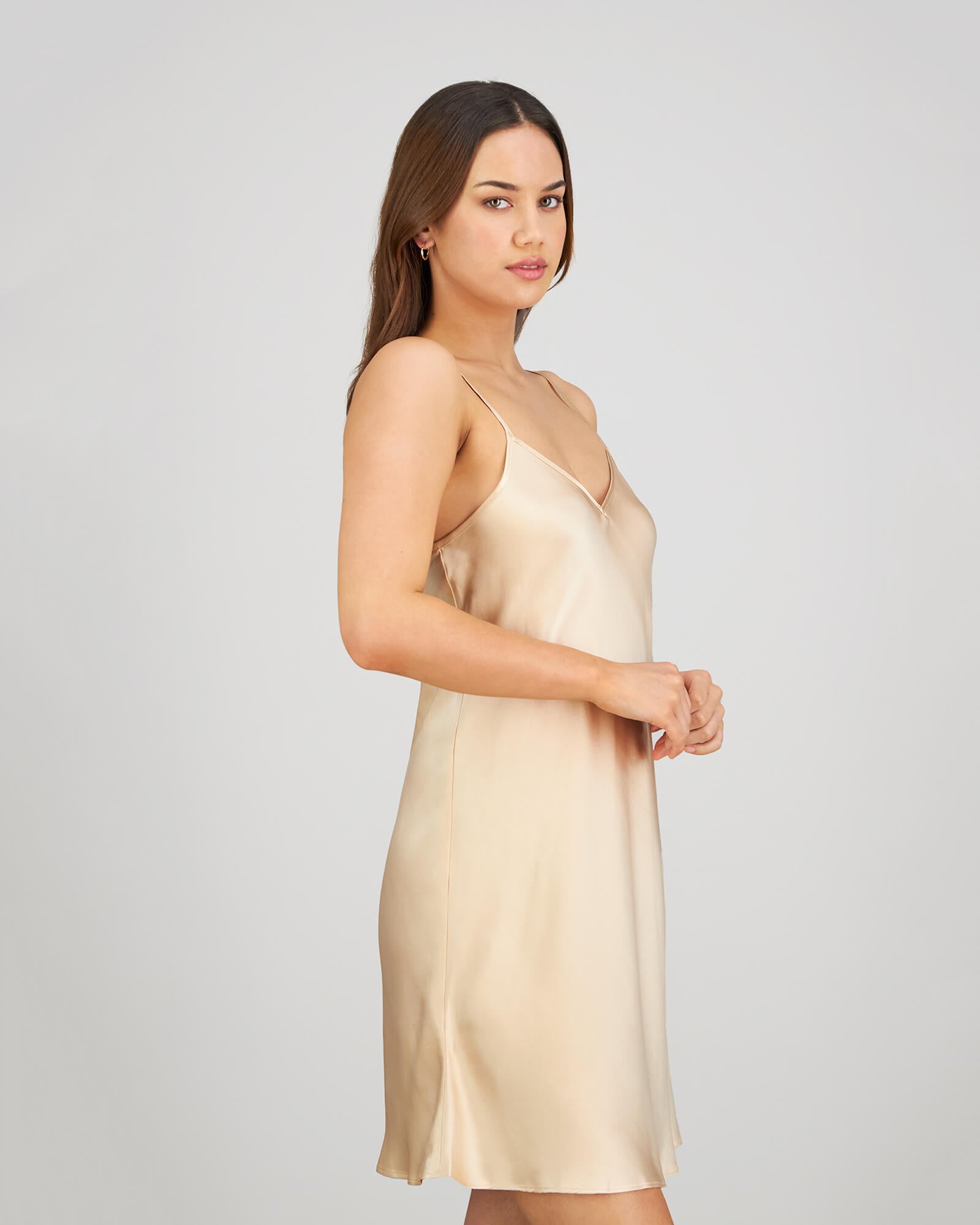Model wears Silk Brilliance Chemise in CHAMPAGNE. On body side view