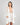 Model wears Eros Robe in SUGAR. On body front view