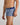 Model wears Retros Print Mens Trunk in OTHELLO PRINT. On body side view