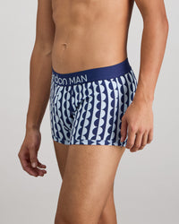 Model wears Retros Print Mens Trunk in OTHELLO PRINT. On body side view