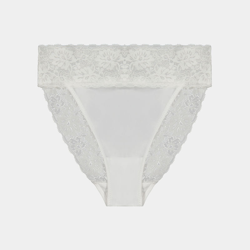 Model wears Lace Trim High Cut Brief in WHITE. On body front view