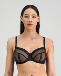 Model wears Sheer Essence Underwire Bra in BLACK. On body front view