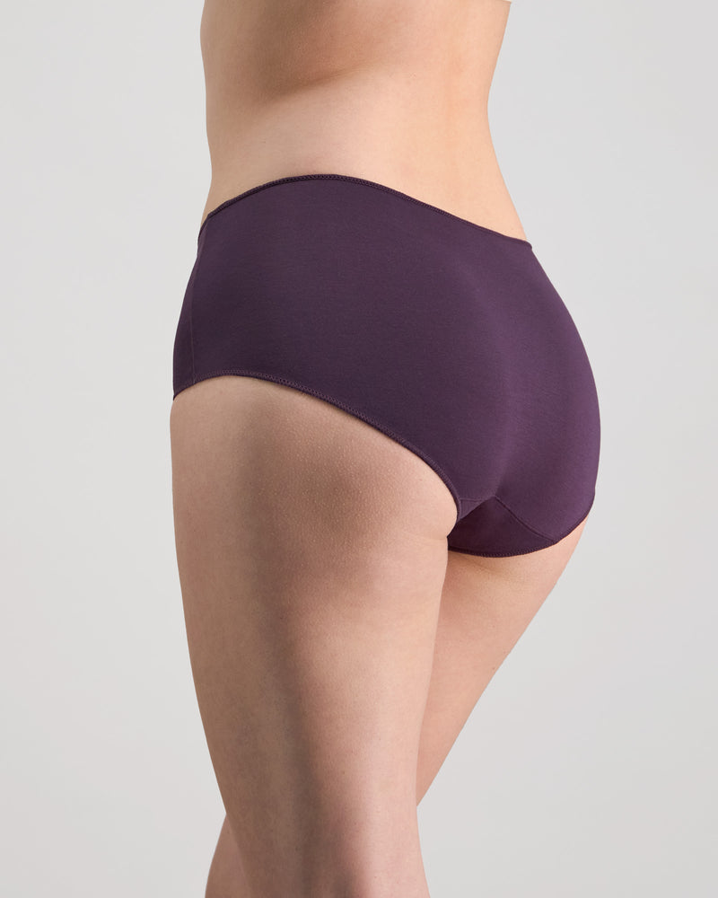 Model wears Au Naturel Full Brief in PLUM PERFECT. On body side view