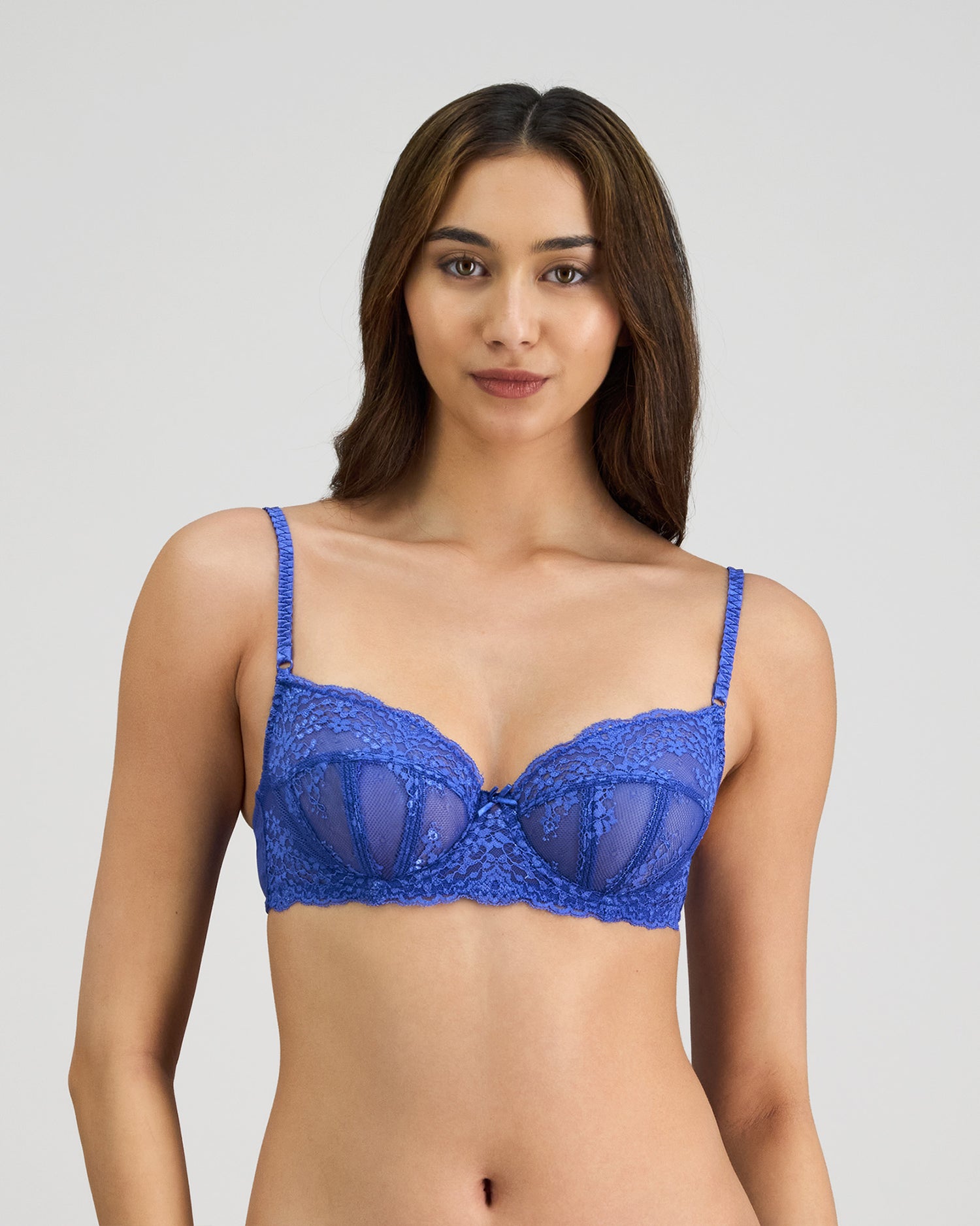 Model wears Sofia Underwire Bra in DAZZLING BLUE. On body front view