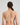 Model wears Rita Contour Bra in LATTE. On body back view