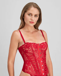 Model wears Lace Me Up Corset in JESTER RED. On body side view
