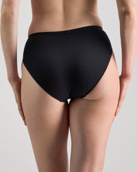 Model wears Body Cotton High Cut Brief in BLACK. On body back view