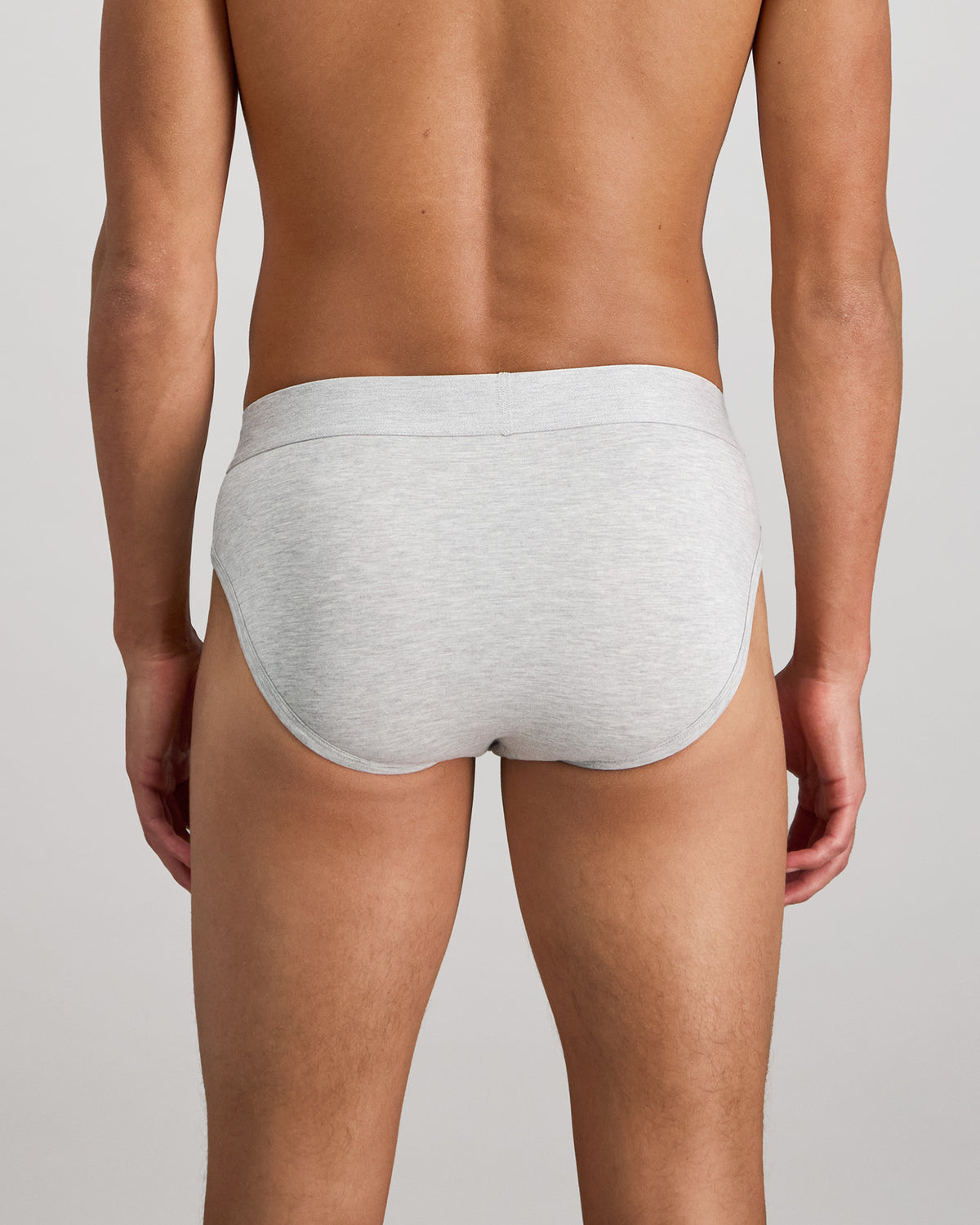 Model wears Bamboo Mens Brief in GREY MARLE. On body back view