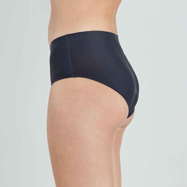 Model wears Flo Heavy Midi in BLACK. On body side view