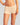 Model wears Simply Seamless Boyshort in Nude. On body side view
