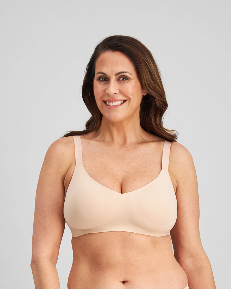 Model wears Comfit Collection Wire Free Bra in LATTE. On body front view