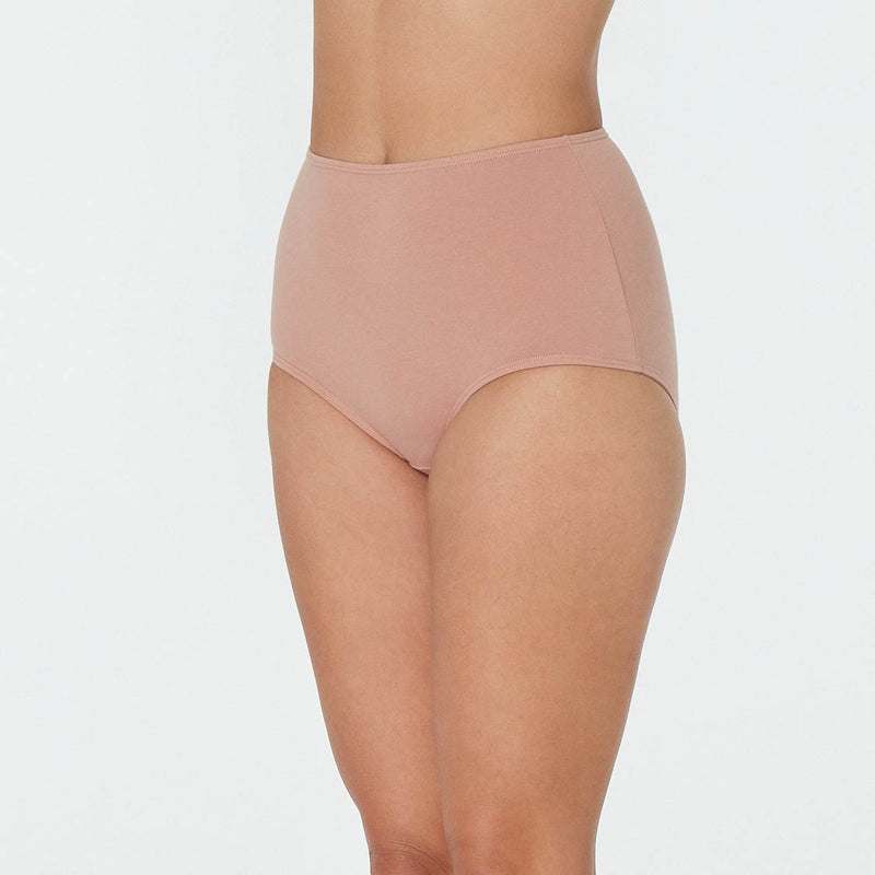 Model wears Freestyle Full Brief in COCOA. On body front view