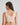 Model wears Comfit Collection Crop Top in LATTE. On body back view