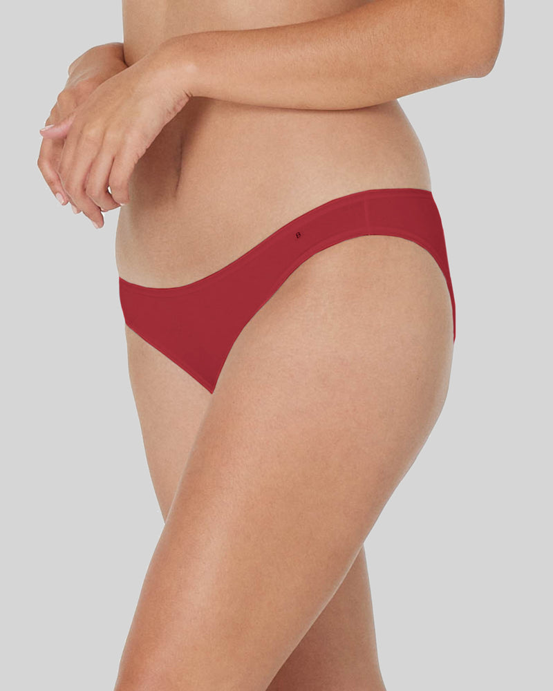 Model wears Clemence Bikini in JESTER RED. On body side view