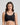 Model wears Comfit Collection Crop Top in BLACK. On body front view