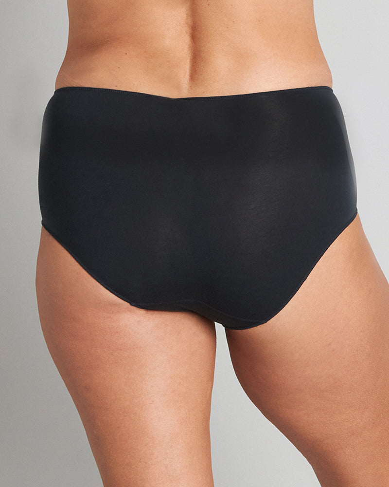 Model wears Au Naturel Full Brief in BLACK. On body back view