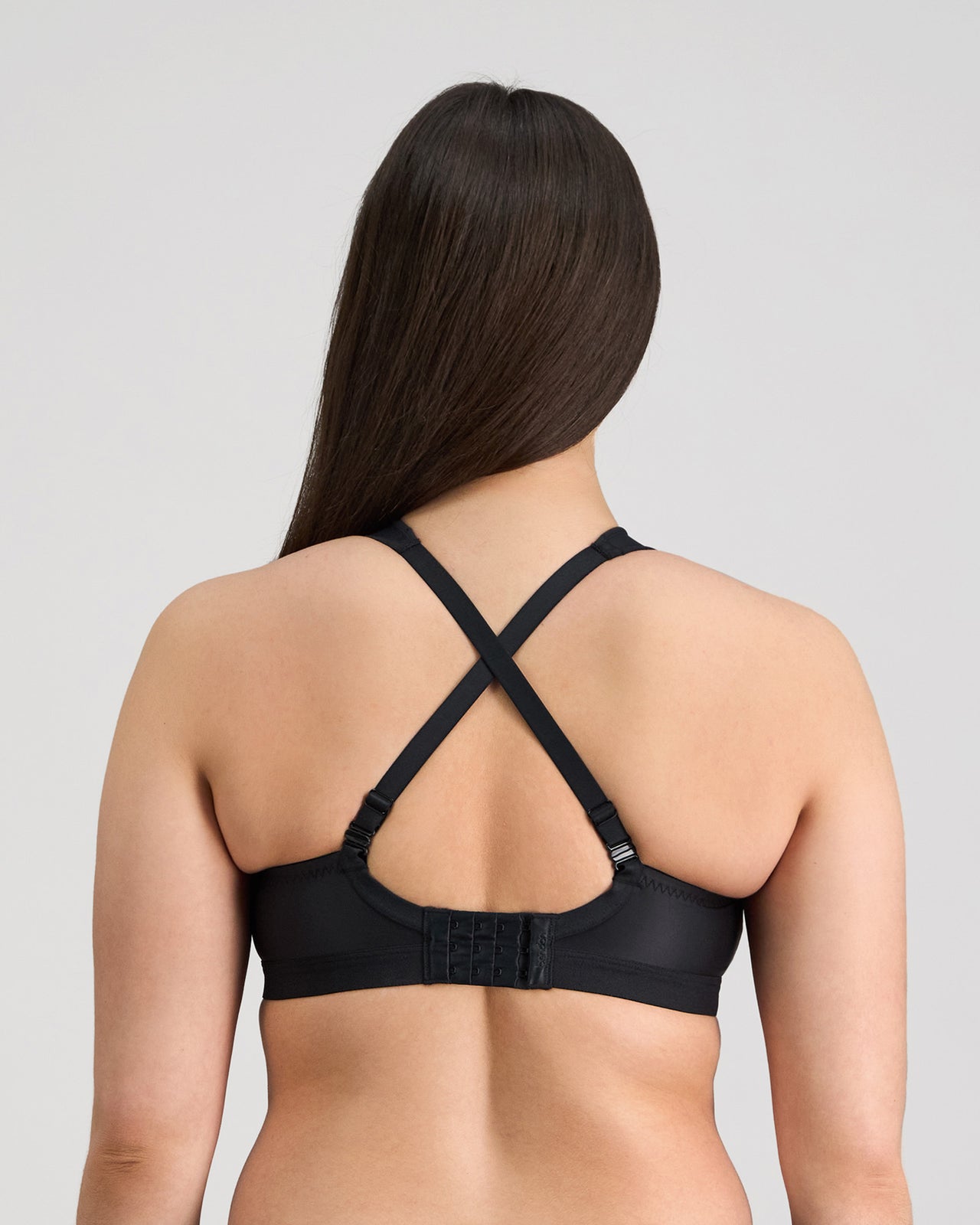 Model wears Stamina Wire Free Bra in BLACK. On body back view