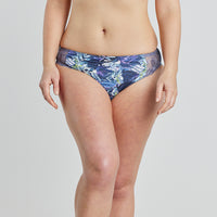 Model wears Violet Floral High Cut Brief in DARK PROTEA PRINT. On body front view