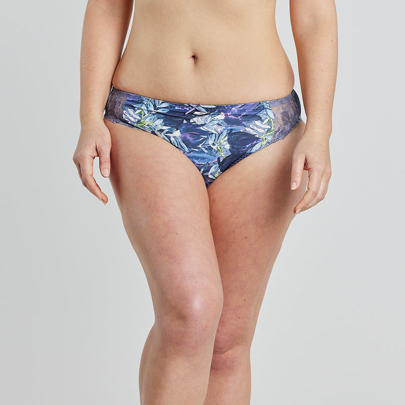 Model wears Violet Floral High Cut Brief in DARK PROTEA PRINT. On body front view