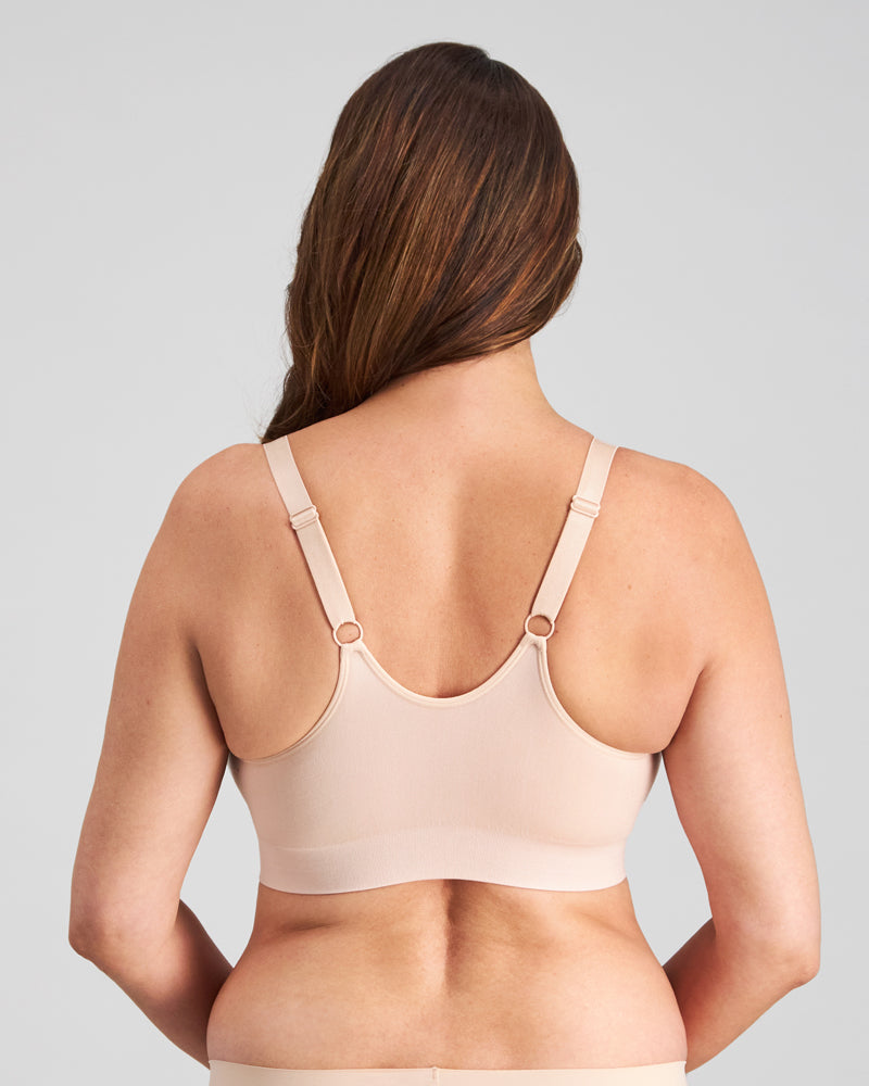 Model wears Bendon Restore Wire Free Front Opening Bra in LATTE. On body back view