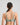 Model wears Power Underwire Bra in ICEBERG GREEN. On body back view