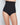 Model wears Bamboo Bodywear High Waisted Brief in BLACK. On body front view