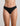 Model wears Extra-Ordinary Thong in BLACK. On body front view