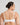Model wears Sculpt Contour Bra in WHITE. On body back view