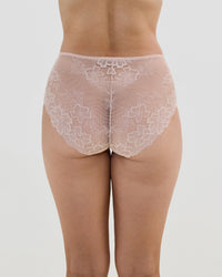 Model wears All Lacey Full Brief in LATTE. On body back view