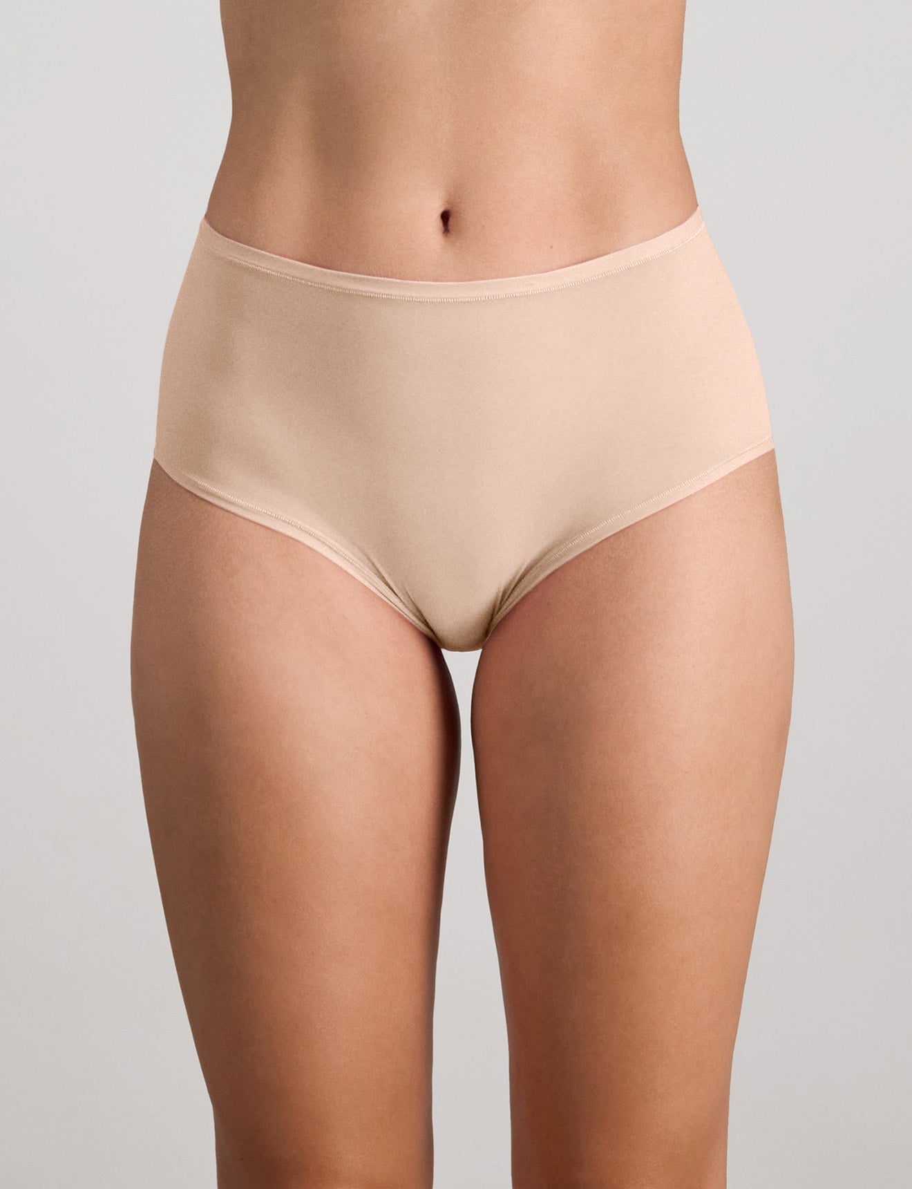 Model wears Extra-Ordinary Full Brief in LATTE. On body front view
