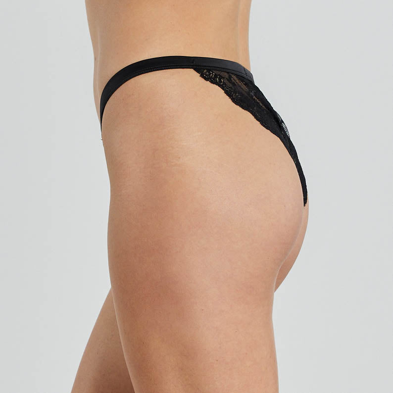 Model wears Fleur Midi in BLACK. On body side view